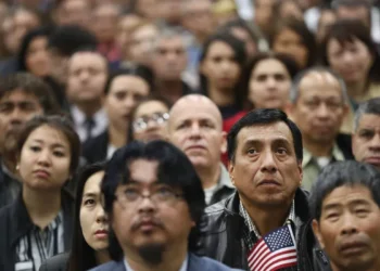 The backlog and the barrier: how US immigration processing fuels citizenship anxiety